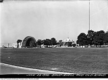 semi-spherical building, partially constructed in large open space