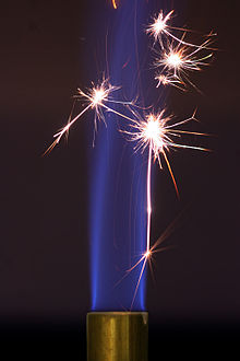 A bunsen burner sustains its flame after the energy threshold is crossed.