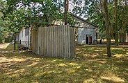 "Legending hall" from the west, with privacy fencing