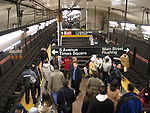 Commuters waiting at the Flushing Line platform of the Grand Central subway station
