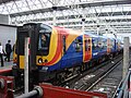 A British SWT Class 450 suburban unit at London Waterloo Station.