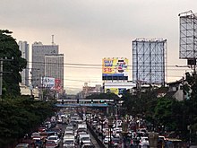 The boulevard with heavy afternoon rush hour traffic