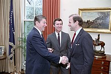 Photo of Biden shaking hands with Reagan in the Oval Office