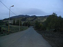 A road leading to Mount Etna on an overcast day.