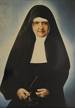 Sint Maria Bernarda Bütler met in haar handen een kloosterregel en rozenkrans.