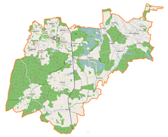 Mapa konturowa gminy Krośnice, blisko centrum na lewo u góry znajduje się punkt z opisem „Parafia Świętego Maksymiliana Marii Kolbego”