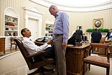 Photo of Obama and Biden shaking hands in the Oval Office