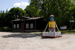 Centre of the village, the chapel at the crossroads and a wooden house