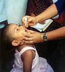 Child receiving the oral polio vaccine