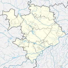 Mapa konturowa powiatu staszowskiego, po prawej znajduje się punkt z opisem „Osiek”