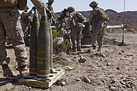 M795 artillery shells with fuzes fitted, labelled to indicate a filling of TNT