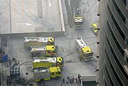 This is a photo of Dubai Civil Defense vehicles at the base of the under-construction Fortune Executive Tower (located in Jumeirah Lake Towers in Dubai, United Arab Emirates) due to a fire there on 15 June 2008.