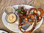 Pretzels served with Camembert-beer cheese and fresh red onion in Salzburg, Austria tavern