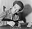 Woody Guthrie playing a guitar