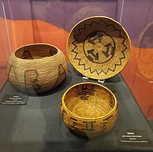 This image is of three coiled baskets with designs that depict mission bells.