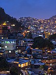 Informal settlements built into the hillside in Rocinha, Rio de Janeiro, Brazil at dusk