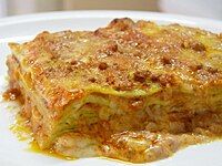 Green lasagna (made with spinach in the dough), with ragù, Parmesan, and béchamel sauce, typical of Bolognese cuisine