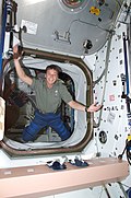 Expedition 5 Flight Engineer Peggy A. Whitson demonstrates proper form for floating through a fully outfitted vestibule.