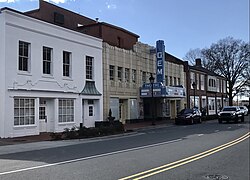 Tan building with a large blue marquee