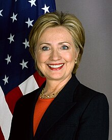 Hillary Clinton dressed in a black suit seen in her official secretary of state portrait in 2009