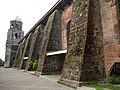 The thick buttresses of the church typical of Earthquake Baroque architecture