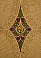 Heraldic crest of British royalty on the ceiling of Bath Abbey, with the motto "Honi soit qui mal y pense".