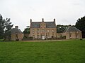 Front elevation showing the two pavilions in the forecourt. The one on the left (west) was for laundry; the one on the right (east) was a stable and coach house block[6]