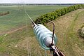 Ophanging met isolatorketting, met vlamboogpinnen voor aarding door een vonkbrug