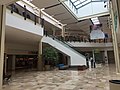 Section of the mall that expanded in 1997-1999 from one to two levels. The old layout only had a lower level with the escalators going up to a higher one-level section. After 1999, the section in front of the escalators expanded to two floors.