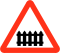 Railway level crossing with gate or barrier