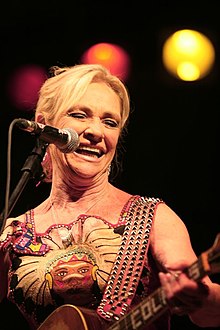 Lorrie Collins sings and performs with a guitar