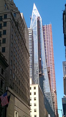 Side view of building from 54th Street, looking west with scaffolding visible
