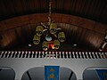 The choir loft with the lacquered wooden ceiling shown