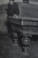 German billiards player Paul Kerkau, shooting on an ornate billiards table, ca. 1920