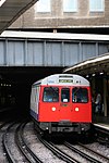 The conduit for the River Westbourne above a Circle Line train at Sloane Square station in 2006