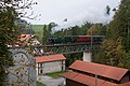 Train passing in front of the mill.