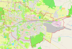 Mapa konturowa Chełma, blisko centrum na lewo znajduje się ikonka pałacu z opisem „Dawny pałac biskupów unickich”