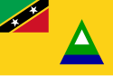 The Nevis flag incorporates the flag of the Federation of Saint Kitts and Nevis in the top left corner. The golden field stands for sunshine. The central triangle represents the conical shape of Nevis, with the blue being the ocean; the green being the verdant slopes of the island; and the white being the clouds that usually wreathe Nevis Peak