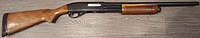 Remington Model 870 Express shotgun, laying on the ground oriented right