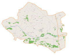 Mapa konturowa gminy Wilczyce, blisko centrum na lewo u góry znajduje się punkt z opisem „Daromin”