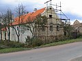 The same house before, during restoration