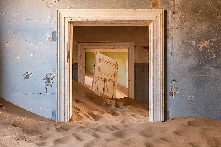 Abandoned building in Kolmanskop. Show another