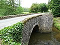 Die Brücke „Pont de la Tour“ über der Isle, die hier die Grenze zu Jumilhac-le-Grand bildet