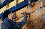 Caulking with caulking hammer, iron and hemp