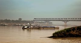 Ferries plying on the river with the bridge in the backdrop