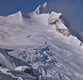 The top of Moby Dick Mountain appears above Pequod Mountain and Pequod Glacier