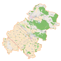 Mapa konturowa powiatu oławskiego, w centrum znajduje się punkt z opisem „Parafia Matki Bożej Pocieszenia”