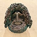 Bronze tragic mask from the mid-4th century and is attributed to the sculptor Silanion