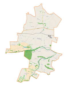 Mapa konturowa gminy Jeżów, blisko centrum na lewo znajduje się punkt z opisem „Dąbrowa”