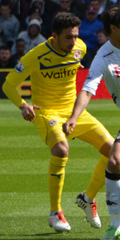 Jem Karacan in Reading's away kit contests with Bryan Ruiz for the ball.